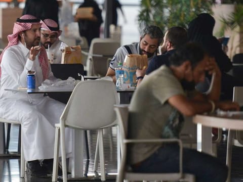People sit at a cafe in a mall in the Saudi capital Riyadh on June 4, 2020, after it reopened following the easing of some restrictions to stem the spread of the novel coronavirus. Picture used for illustrative purposes only.
