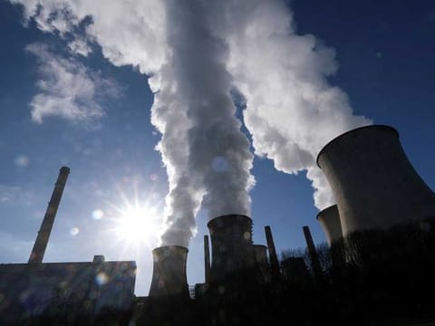 Steam rises from the cooling towers of the lignite power plant complex of German energy supplier and utility RWE in Neurath, north-west of Cologne, Germany, on February 5, 2020.