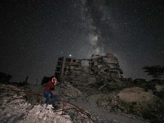 Milky Way glimmers over sea of rubble in Syria