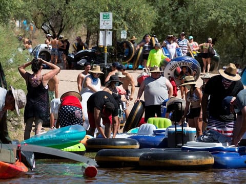 People go tubing on Salt River amid the outbreak of the coronavirus disease (COVID-19) in Arizona, U.S., June 27, 2020.