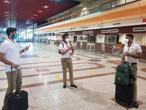 Pakistan cricketers Babar Azam (right), Imad Wasim (left) and Imam-ul-Haq chat at the Allama Iqbal International airport in Lahore before their departure for England earlier this week.