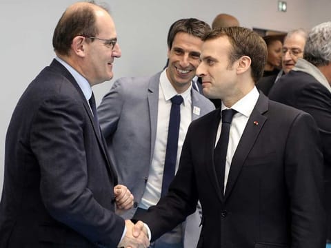 French President Emmanuel Macron shakes hands with Jean Castex (left) in Creteil, on the outskirts of Paris, on January 9, 2019. Castex replaced Edouard Philippe as prime minister.