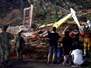 Desperate searches as dozens feared dead in Japan floods