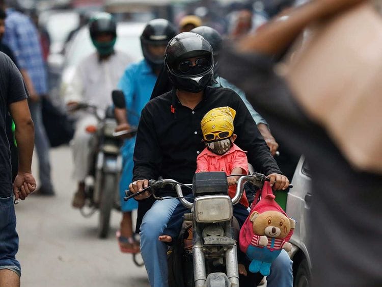 Karachi mask boy motorcycle Pakistan