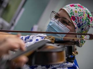 Strains of hope: Chilean nurse serenades COVID-19 patients with violin 
