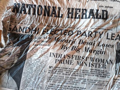 A picture taken on July 9, 2020, at the Bossons glacier near Chamonix in the French Alps, shows a 1966 copy of Indian newspaper The Herald with a healdline announcing the election of Indira Gandhi, likely to have been on board the Air India Boeing 707 "Kangchenjunga" aircraft that crashed in the nearby Mont Blanc massif on January 24, 1966.