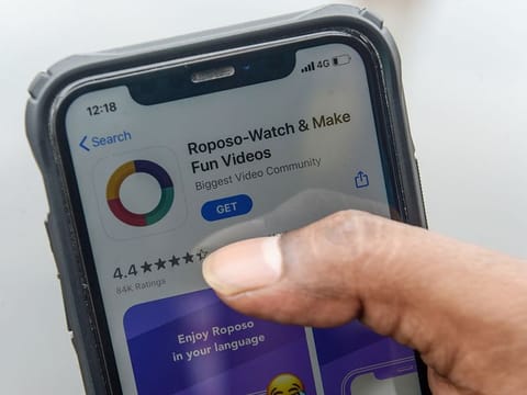 A man browses on an online store the Indian app platform Roposo in Chennai. Millions have joined homegrown social media platforms after India banned 59 Chinese apps, including TikTok, amidst a growing showdown between the neighbours. 