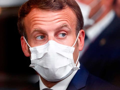 France's President Emmanuel Macron leaves at the end of the opening day the European Union Council in Brussels on July 17, 2020, as the leaders of the European Union hold their first face-to-face summit over a post-virus economic rescue plan. 