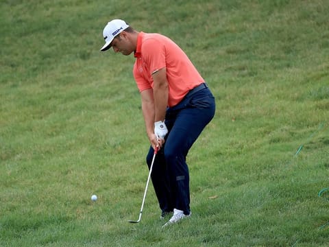 Jon Rahm chips in for birdie on the 16th hole during the final round of The Memorial Tournament at Muirfield Village Golf Club in Dublin, Ohio