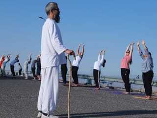 Photos: Kurdish men and women practise yoga on Mount Azmar in Iraq