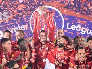 Football: Liverpool players receive English Premier League trophy on Kop 