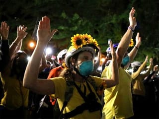 Photos: 'Wall of Moms' face down federal officers in Portland