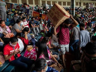 COVID-19 testing: Thousands cram into stadium in Manila