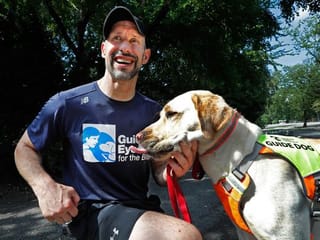 Photos: Guide dogs helping blind runners stay fit despite COVID-19 pandemic
