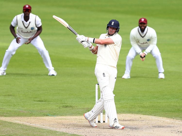 England's Stuart Broad plays a shot during the second day of the third cricket Test match against West Indies at Old Trafford.