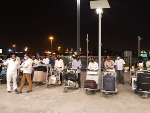 Forty stranded Indian workers flew home from Sharjah to Hyderabad on Saturday on an Air India repatriation flight .