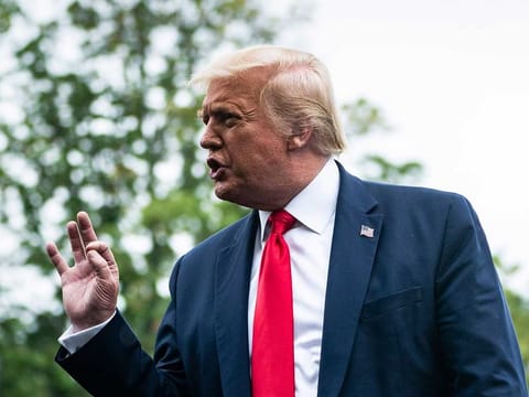 US President Donald Trump talks to reporters at the South Lawn of the White House on July 31, 2020. 