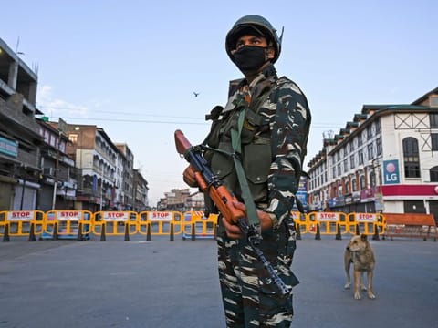 A paramilitary soldier stands guard at a checkpoint during a curfew in Srinagar on August 4, 2020. A curfew has been imposed across Kashmir just two days before the first anniversary of New Delhi's abolition of the region's semi-autonomy, officials said late August 3. 