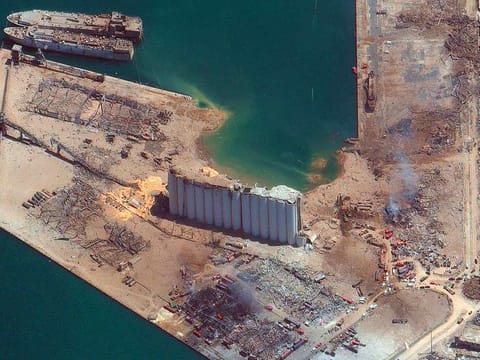 This satellite image provided by Maxar Technologies shows the port of Beirut in Lebanon on Wednesday, Aug. 5, 2020, the day after a massive explosion that left entire city blocks blanketed with glass and rubble.