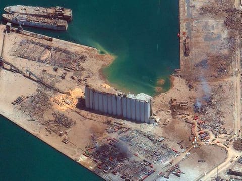 This satellite image provided by Maxar Technologies shows the port of Beirut in Lebanon on Wednesday, Aug. 5, 2020, the day after a massive explosion that left entire city blocks blanketed with glass and rubble.