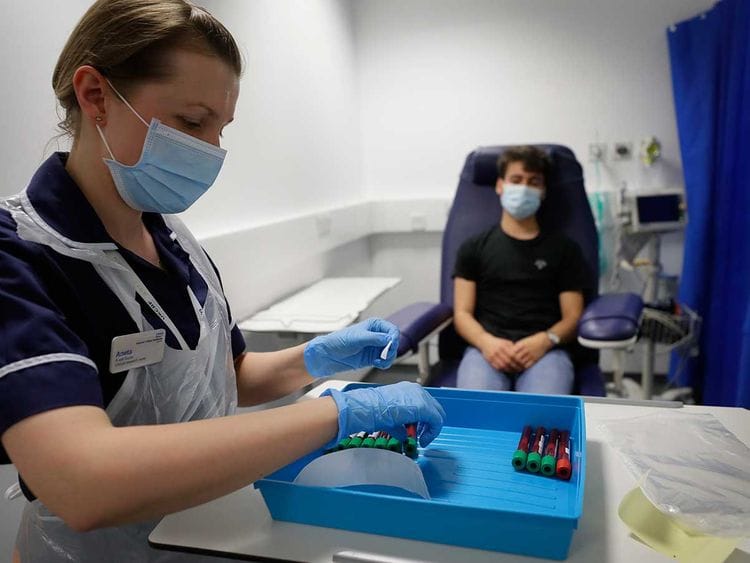 blood sample vaccine london UK mask