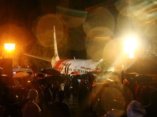 Pictures: Dubai-Kerala Air India Express flight crashes, splits into two