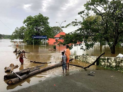 Floodwaters surround the Shiva temple Aluva as the entire district is under red alert for likely heavy rainfall at Ernakulam district, in Kochi on Friday.