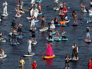 Photos: Paddleboard enthusiasts bring colours to St. Petersburg canals