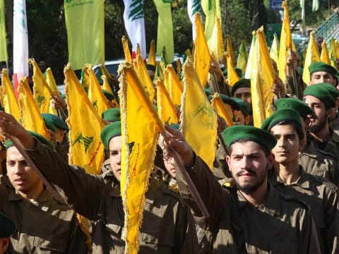 Hezbollah fighters take part in a military parade in the southern town of Ghazieh, south of the port city of Sidon in this file picture.