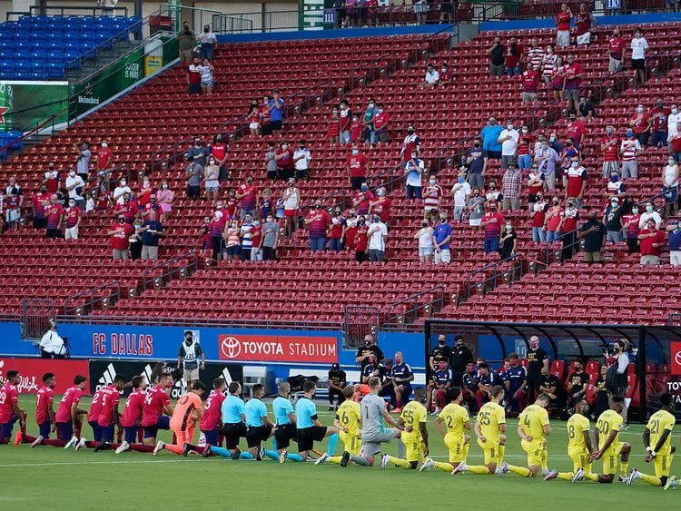 Dallas and Nashville players are booed as they take a knee