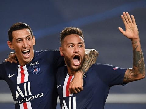Paris Saint-Germain's Argentine midfielder Angel Di Maria (left) celebrates  with Brazilian forward Neymar after scoring his team's second goal during the Uefa Champions League semi-final against Leipzig at the Luz stadium in Lisbon on Tuesday.