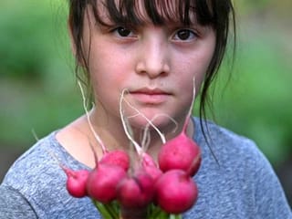 Children grow vegetable gardens in El Salvador to survive COVID-19 pandemic