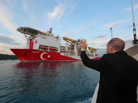 Turkish President Recep Tayyip Erdogan waves as Turkey's drilling vessel Fatih departs for the Black Sea during a ceremony in Istanbul on May 29, 2020. 
