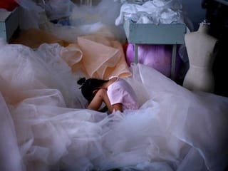 COVID-19 dampens celebrations in China's wedding gown city 