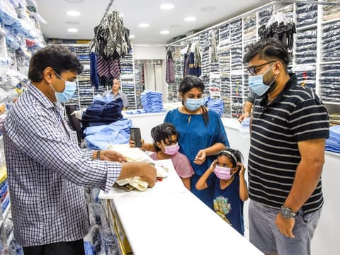 Parents buying school uniforms for their children at the Pony Uniform store in Sharjah 