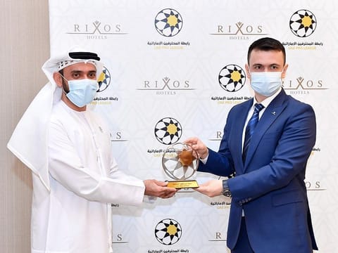 Waleed Al Hosani, UAE Pro League CEO (left) and Cenk Unverdi, Rixos Hotels' Regional General Manager, pose after signing the agreement.