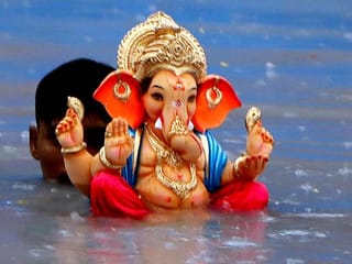 Photos: Devotees bid farewell to Lord Ganesha on the last day of Ganesh Chaturthi festival in India