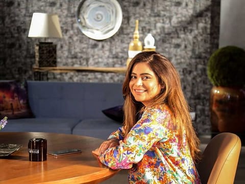 In this undated handout picture taken in 2019 and received as a courtesy of Kanwal Ahmed on September 2, 2020, former make-up artist Kanwal Ahmed, who is the founder of social online group 'The Soul Sisters Pakistan', poses for a photograph on the set of her online talkshow in Pakistan's port city of Karachi. 
