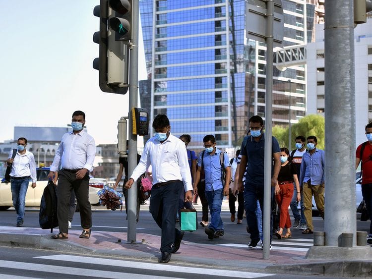 Stock Dubai office staff working street