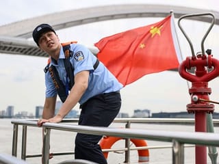 Chinese swimmer goes from Olympic podium to river police