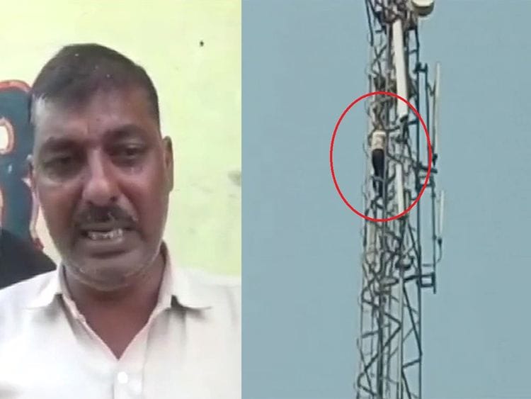Man climbs up mobile tower