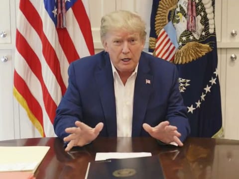 U.S. President Donald Trump, who is being treated for the coronavirus disease (COVID-19) in a military hospital outside Washington, speaks from his hospital room, in this still image taken from a video supplied by the White House.