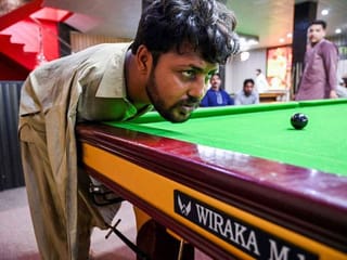 Born without arms, Pakistani snooker player masters the game