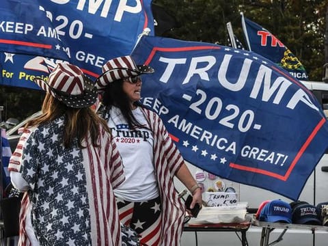 People participate in a pro-Trump rally on October 11, 2020 in Ronkonkoma, New York. With President Trump testing positive for the coronavirus and less than one month left until the U.S. Presidential election, Trump supporters have been organising weekly rallies. 