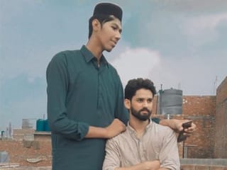 In pictures: Pakistan's Mudassir Gujjar, who aims to be the tallest cricketer