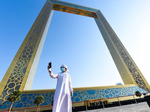 An Emirati takes a selfie at Dubai Frame. 