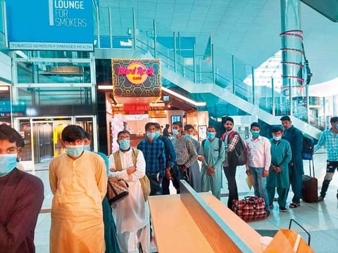 Pakistani passengers stranded at T3 of Dubai International Airport.