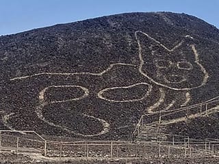 Photos: Peruvian archaeologists unveil giant cat carved into Nazca hillside 