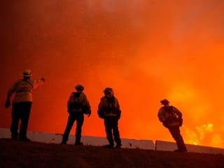 Pictures: Thousands flee homes near Los Angeles as wildfires rage