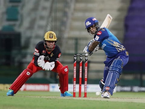 Suryakumar Yadav of the Mumbai Indians drives against the Royal Challengers Bangalore in the IPL 2020 game in Abu Dhabi on October 28, 2020.